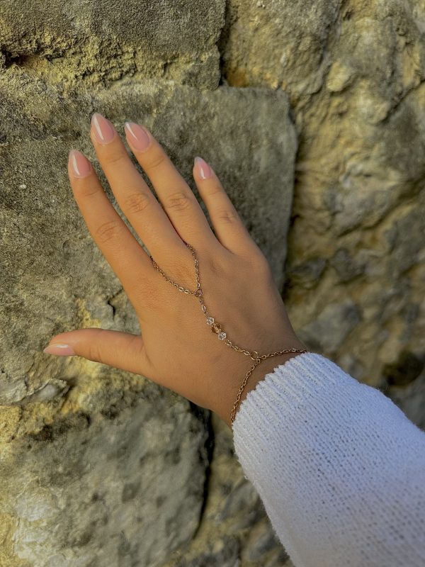 Chaîne de main trois cristaux en acier inoxydable doré avec cristaux blancs et champagne – Thaïs Jewels